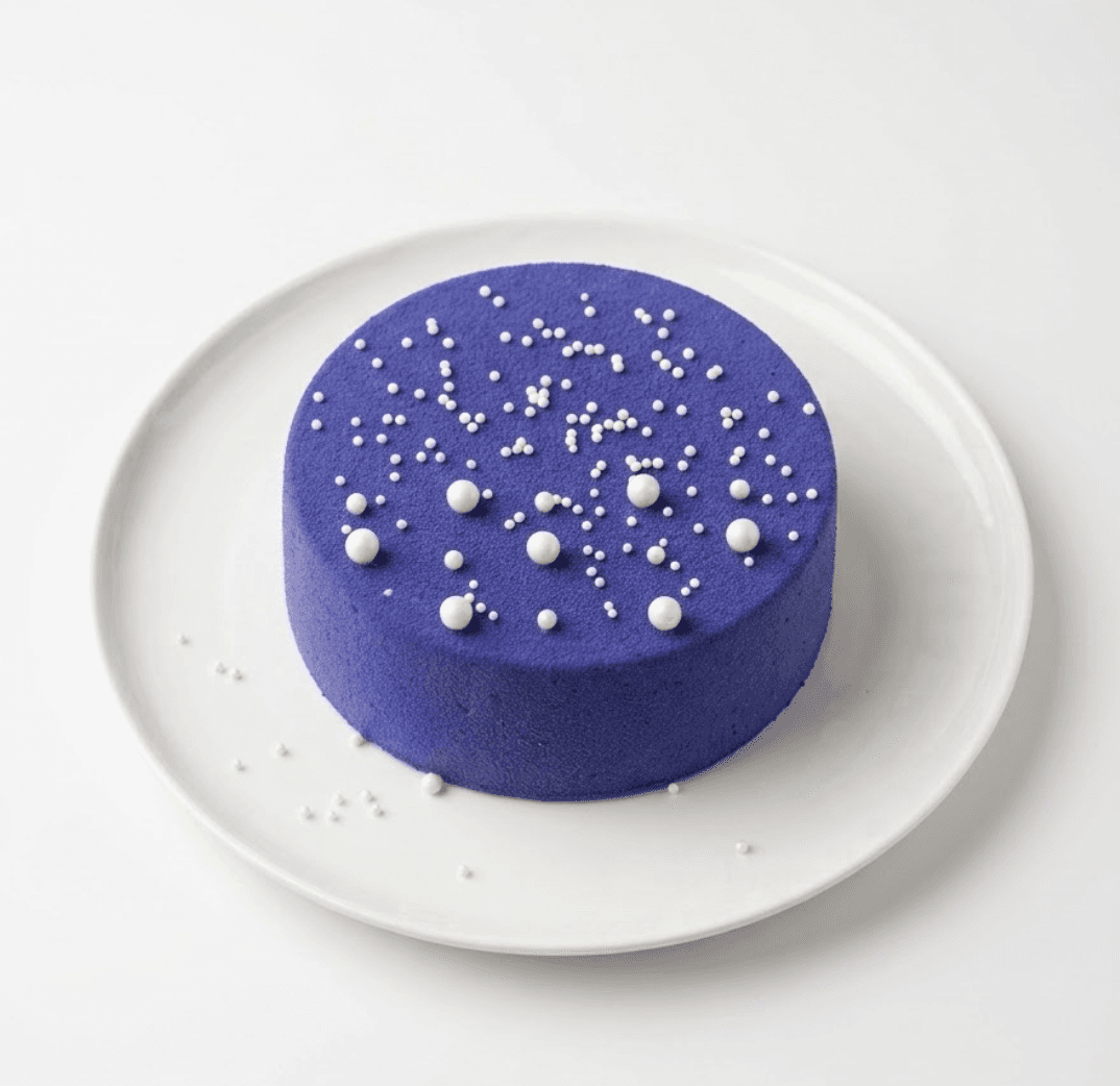 Purple velvet bento cake with pearl bead decorations — signature design