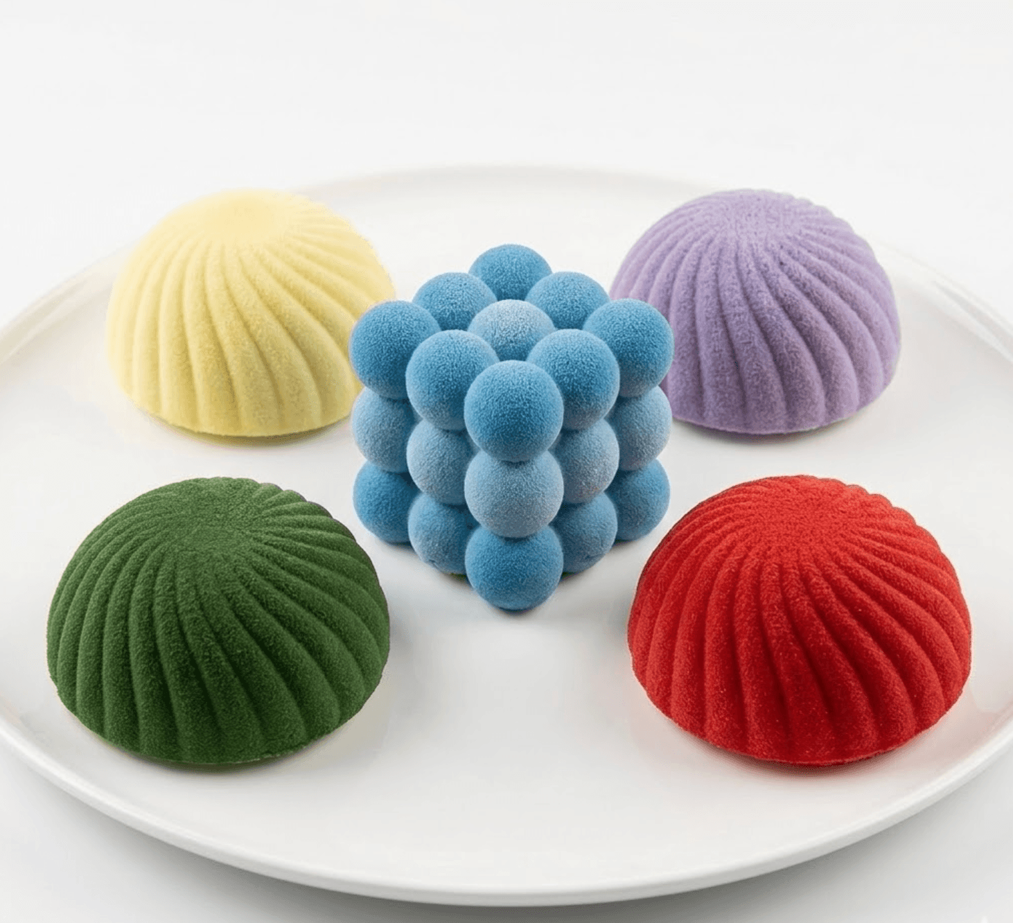 Rainbow handcrafted mousse shell desserts — signature collection